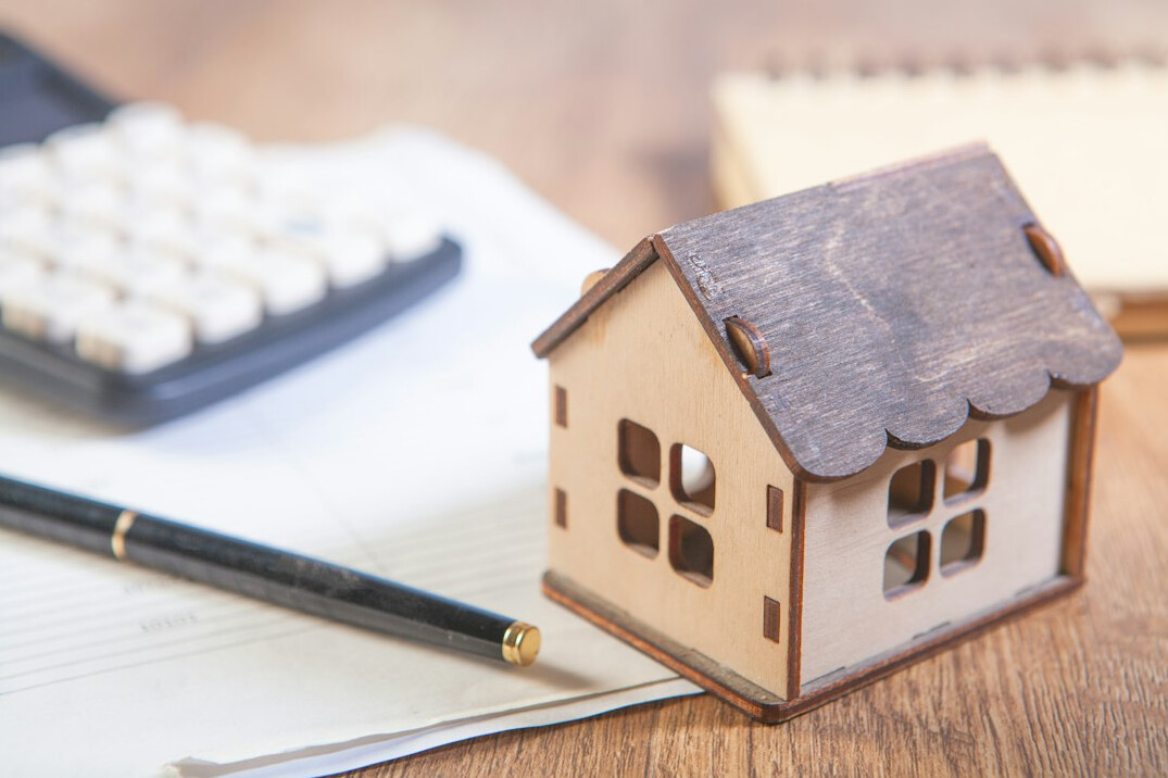 house with insurance documents